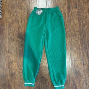 Green sweats with cheetah print pockets